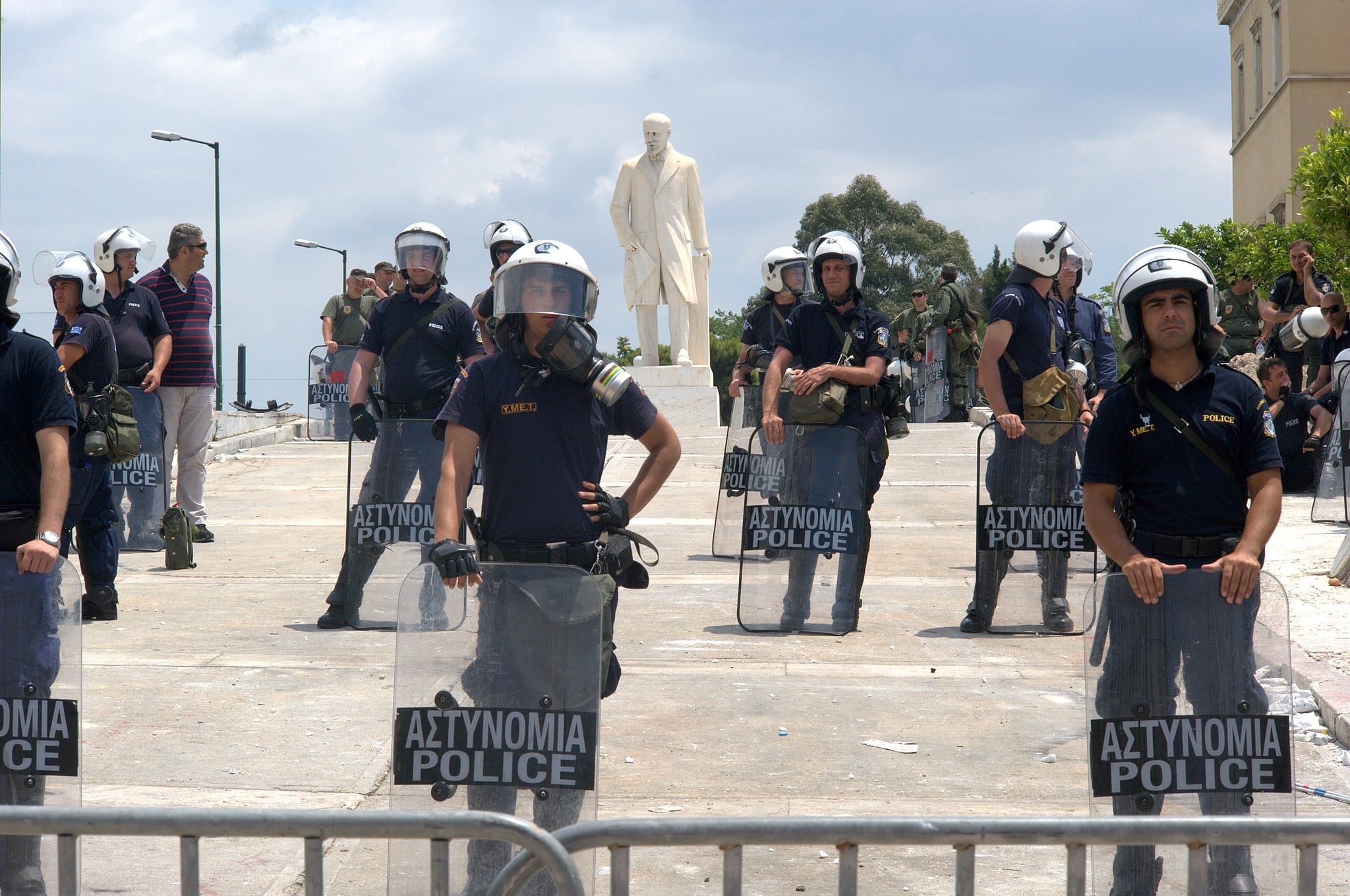 Police_guarding_Greek_parliament_during_demonstrations_Athens_Greece