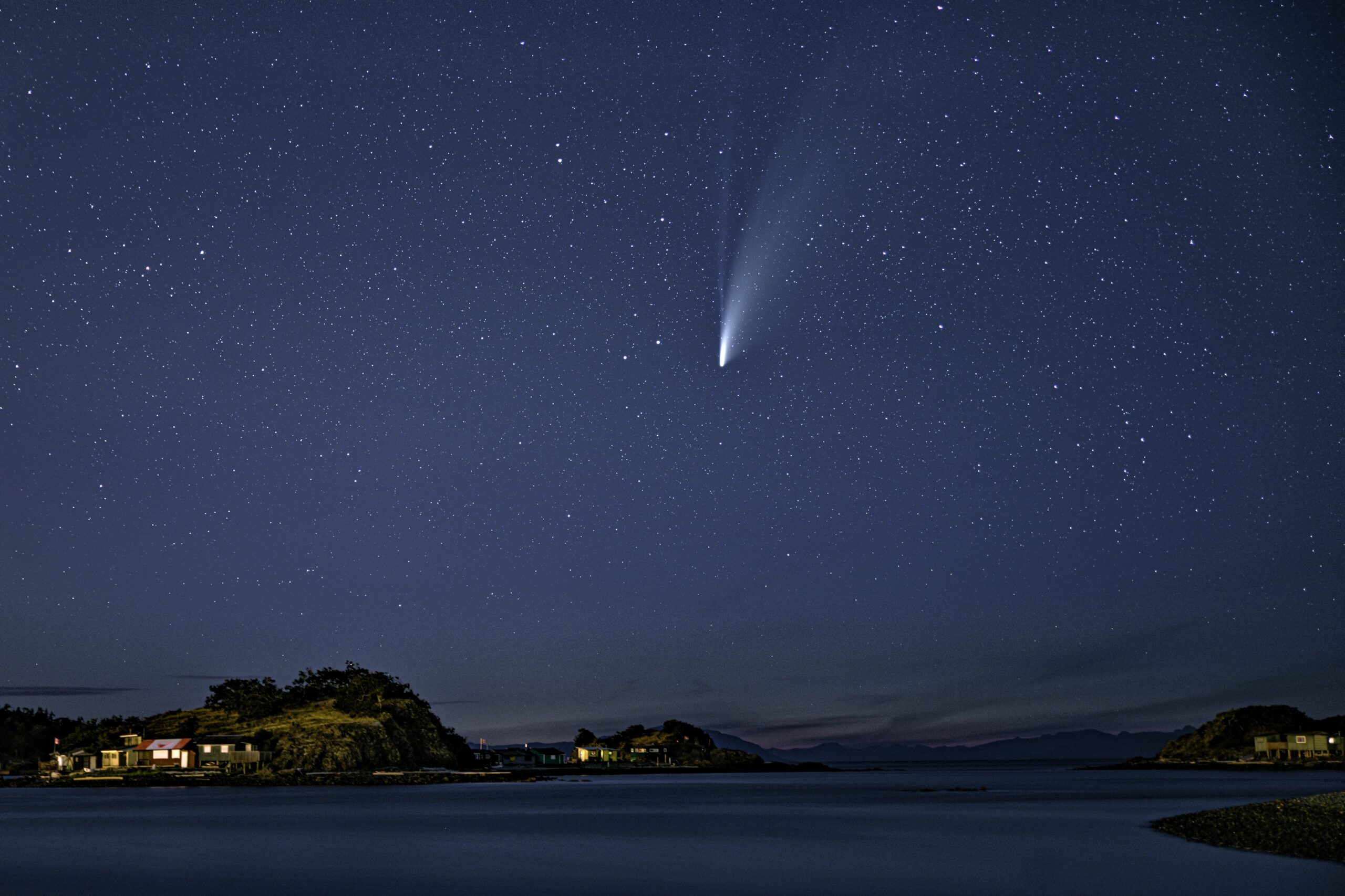 Comet NEOWISE over Piper's Lagoon. Both the white dust trail and the blue ion tail are clearly visible.