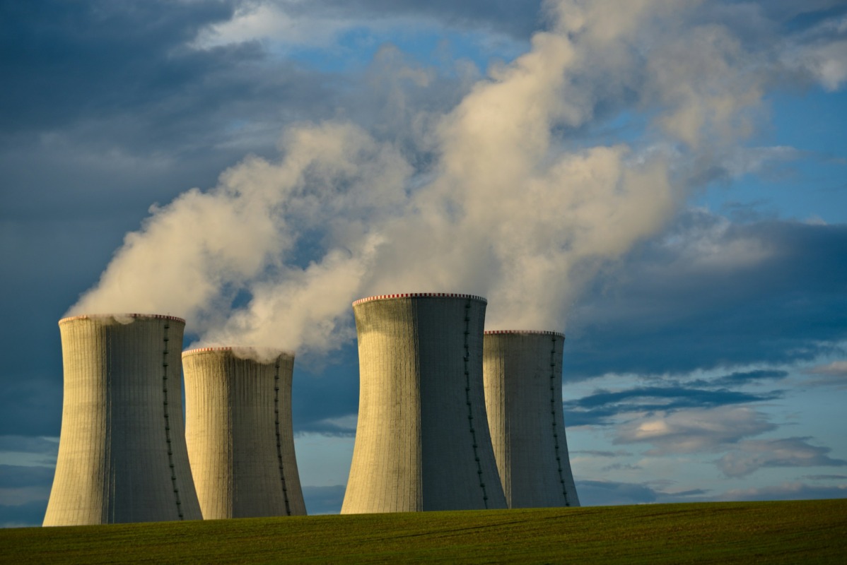 gray-concrete-towers-under-white-clouds-and-blue-sky-during-daytime=