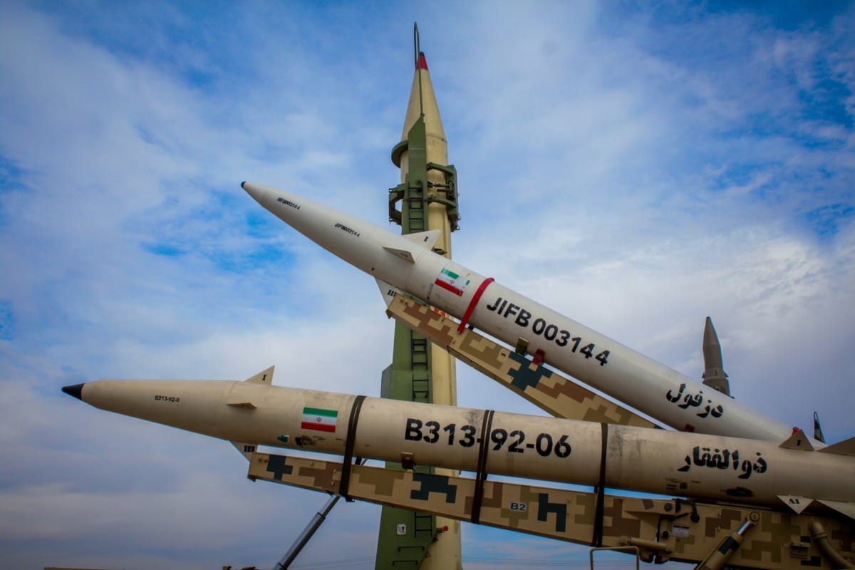 a-group-of-fighter-jets-sitting-on-top-of-each-other-stockpack-unsplash