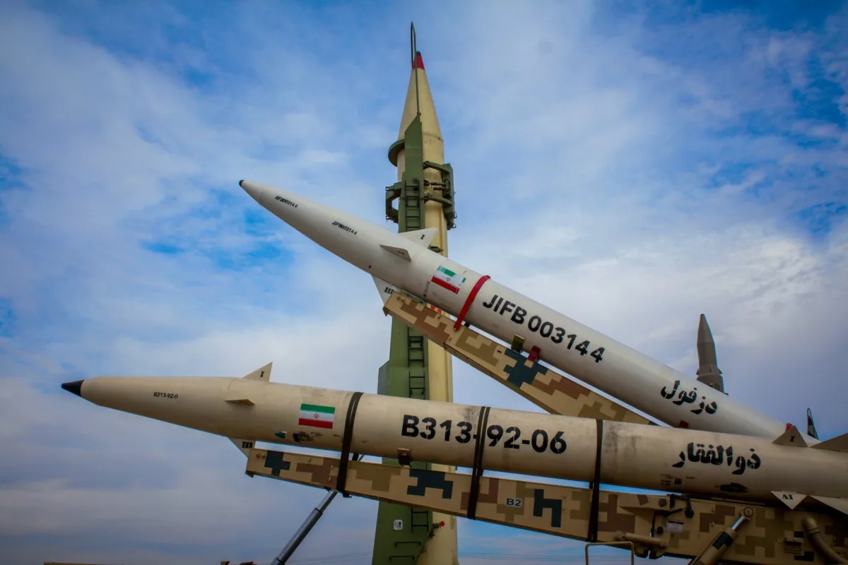 a-group-of-fighter-jets-sitting-on-top-of-each-other-stockpack-unsplash